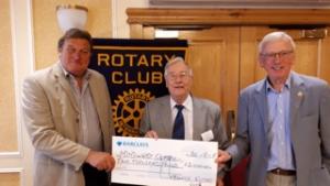 President Colin Bentley and Mike Ryder present a cheque to MIND 